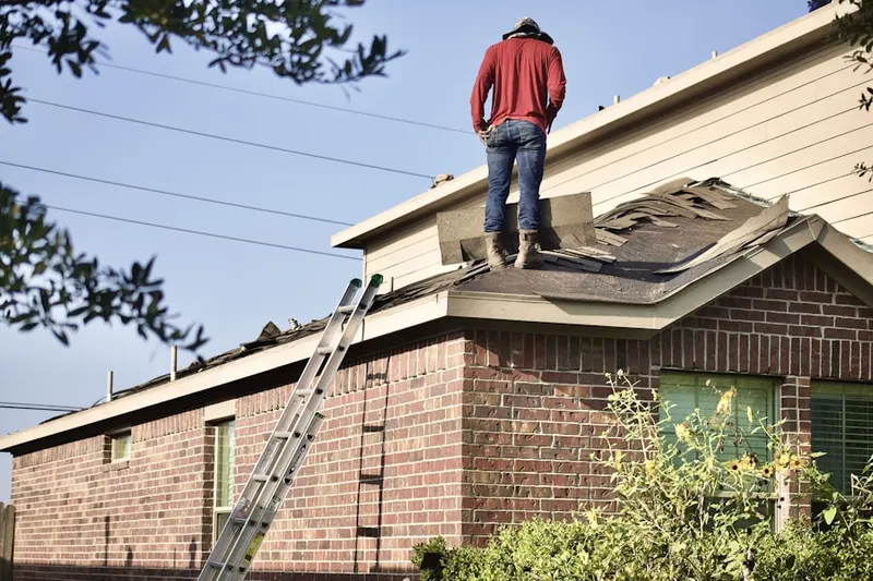 Professional roofer working on a residential roof in East Cleveland